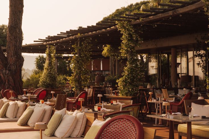 Hotel Lillien, an editorial Upstate New York wedding venue featuring an open-air restaurant terrace with modern design and lush greenery.