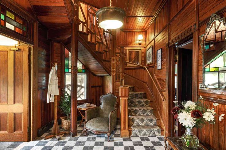 Historic wood-paneled staircase inside Hotel Lillien, a Hudson Valley wedding venue blending vintage charm with modern elegance.