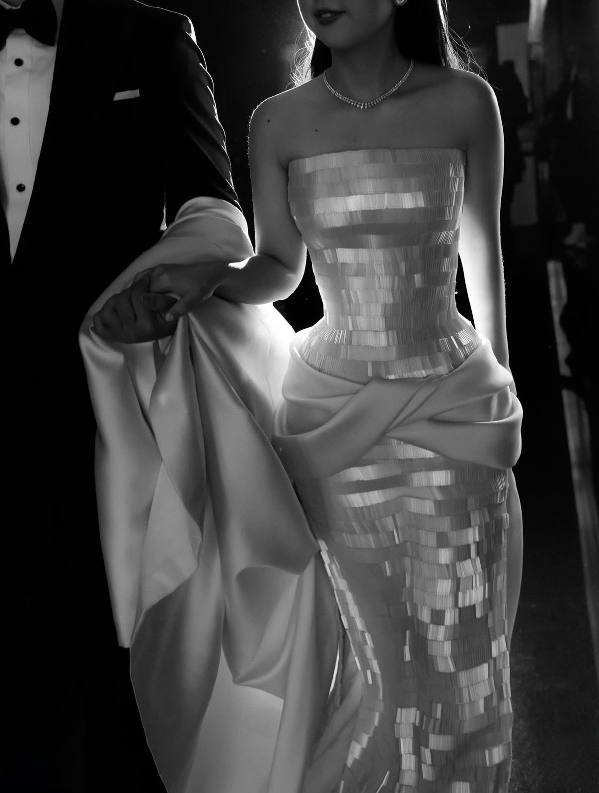 Yogie Pratama couture wedding dress featuring a strapless bodice and structured silk drape, captured in an editorial black-and-white bridal portrait.