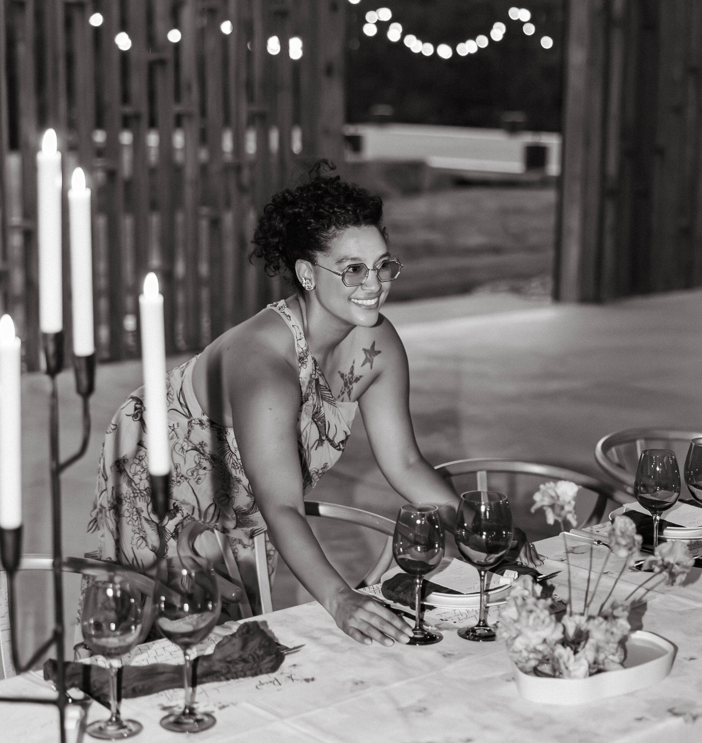 Wedding planner Mikaela Hall, founder of Fox & Quinn, styling an elegant candlelit tablescape at Gather Greene in the Catskills, New York — a behind-the-scenes moment that reflects Fox & Quinn’s philosophy of intentional, story-driven wedding design.