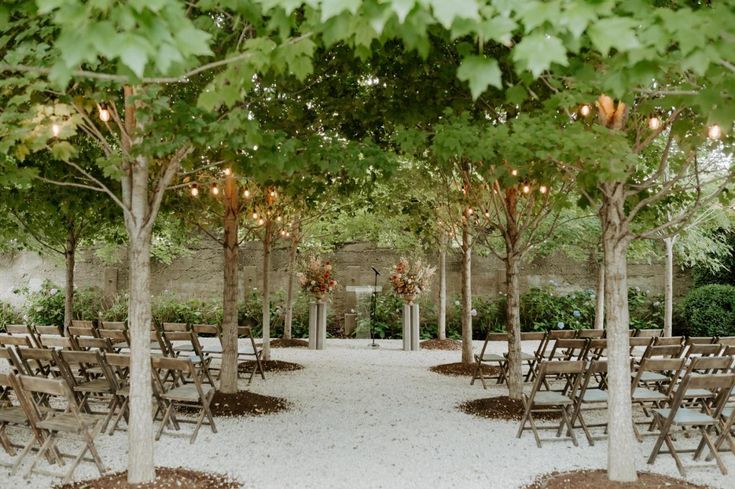 Tree-lined ceremony space at Valley Rock Inn & Mountain Club, an Upstate New York wedding venue blending modern garden design with natural beauty.