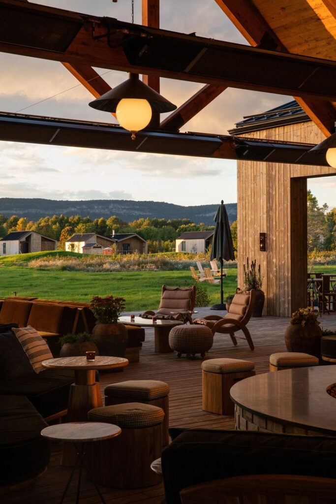 Evening at Wildflower Farms, an editorial Hudson Valley wedding venue with warm modern design, cozy seating, and mountain views.