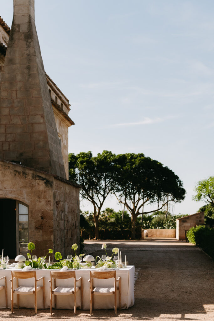 Welcome dinner table beside the sandstone manor at Son Vell, Menorca