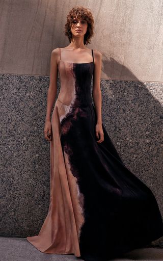 Wedding guest in a sleeveless blush and black tie-dye gown with a square neckline and flowing silhouette — artistic, tonal guest attire for an Earthy & Elevated wedding style.