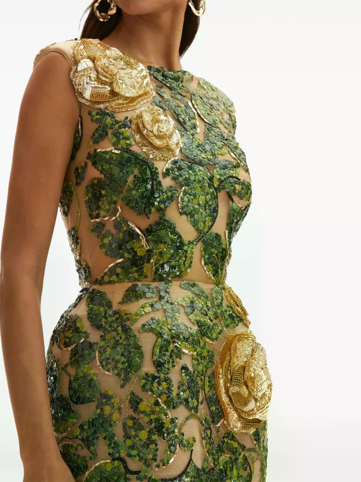 Sheer gown adorned with sequin-embroidered green vines and three-dimensional gold rose appliqués—an opulent take on enchanted garden glamour.
